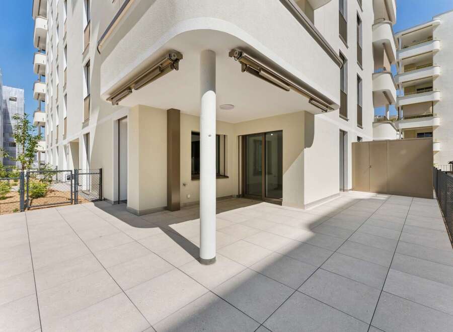 Enjoy outdoor living on this spacious patio, perfect for entertaining or relaxing.
