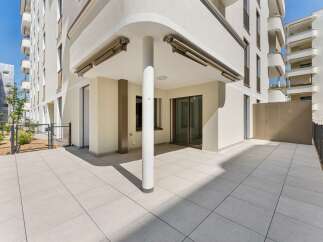 Enjoy outdoor living on this spacious patio, perfect for entertaining or relaxing.