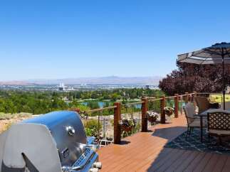 Enjoy breathtaking panoramic views from this stunning deck, perfect for entertaining or relaxing.