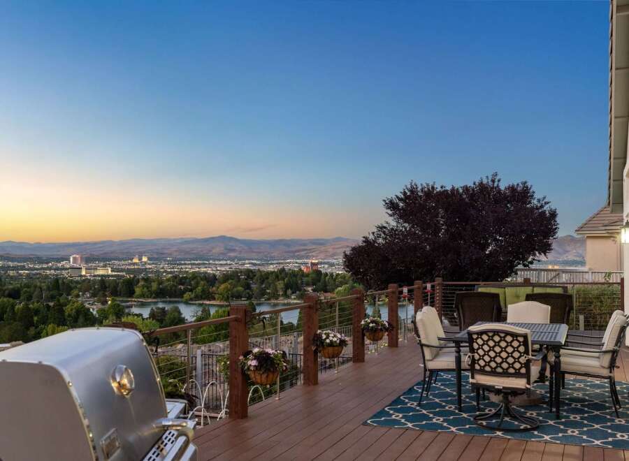 Experience breathtaking panoramic views from this stunning deck, perfect for entertaining or enjoying a quiet evening.