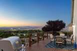 Experience breathtaking panoramic views from this stunning deck, perfect for entertaining or enjoying a quiet evening.