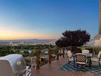 Experience breathtaking panoramic views from this stunning deck, perfect for entertaining or enjoying a quiet evening.