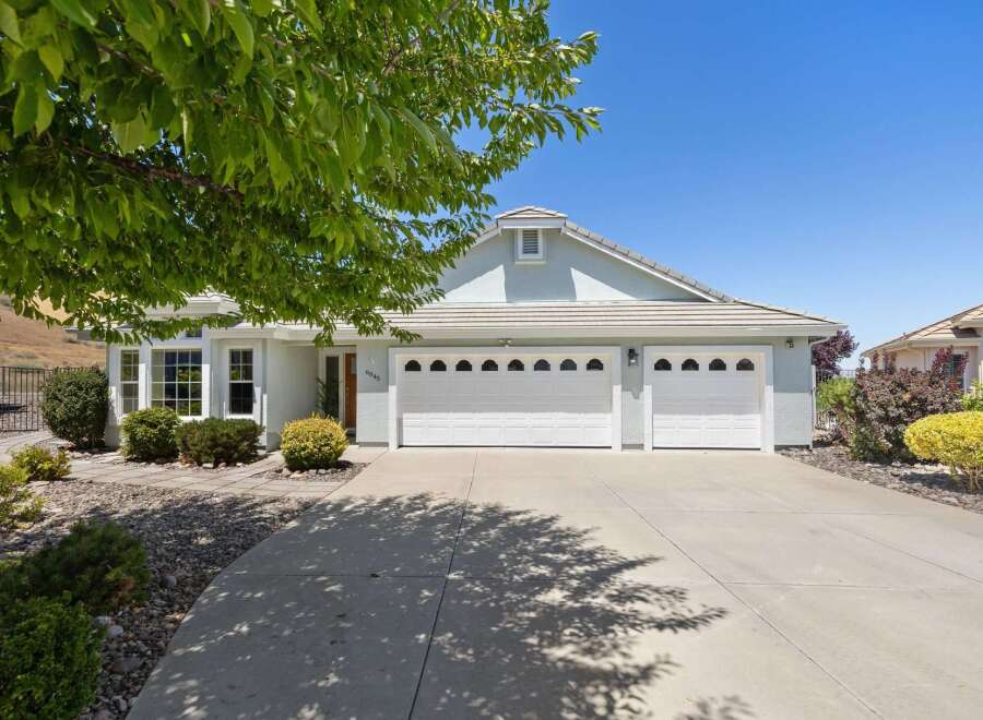 Discover this charming single-story home featuring a spacious three-car garage and a beautifully landscaped front yard.