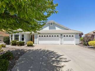 Discover this charming single-story home featuring a spacious three-car garage and a beautifully landscaped front yard.