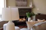 Cozy up by the fireplace in this inviting living room, perfect for relaxing evenings.