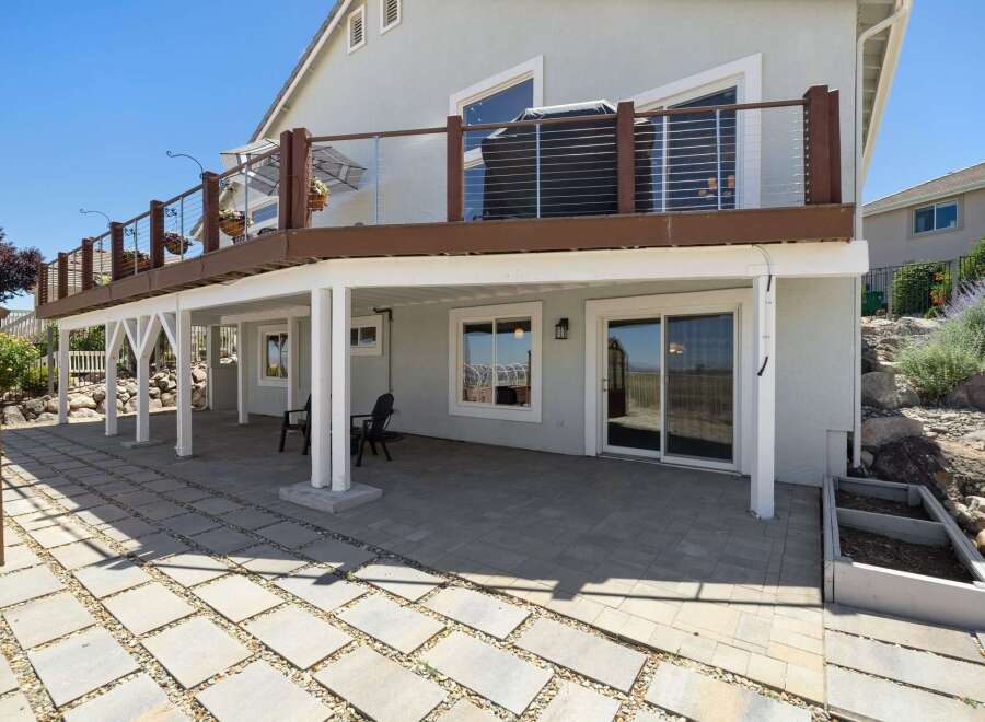 Enjoy outdoor living with this spacious patio, perfect for entertaining or relaxing.
