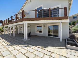 Enjoy outdoor living with this spacious patio, perfect for entertaining or relaxing.