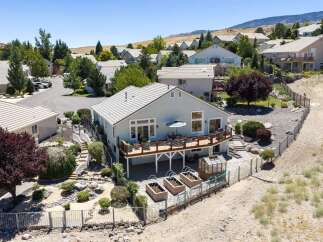 Discover this stunning home with a spacious deck perfect for entertaining and enjoying the scenic views.