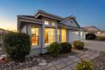 Discover this charming home featuring a welcoming facade with large windows that illuminate the interior.
