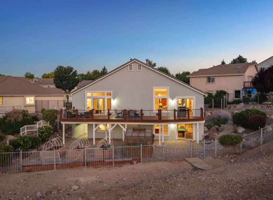 Experience outdoor living at its finest with this stunning home featuring a spacious deck perfect for entertaining and enjoying the twilight views.