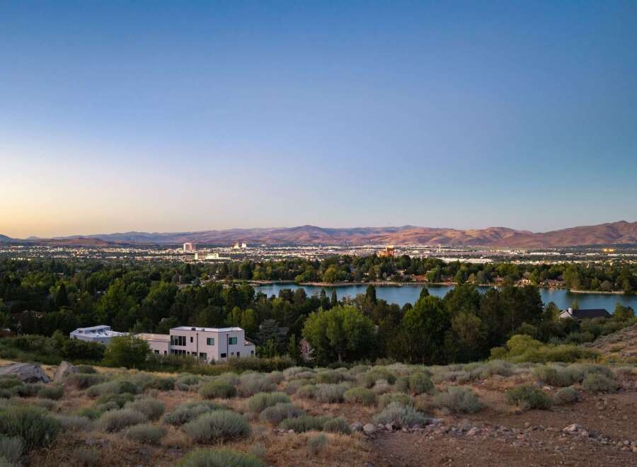 Experience breathtaking panoramic views of the city skyline and a serene lake from this elevated vantage point.