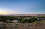 Experience breathtaking panoramic views of the city skyline and a serene lake from this elevated vantage point.