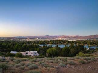 Experience breathtaking panoramic views of the city skyline and a serene lake from this elevated vantage point.