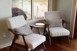 Relax in comfort and style in this inviting living space, featuring two plush armchairs perfect for quiet reading or conversation.