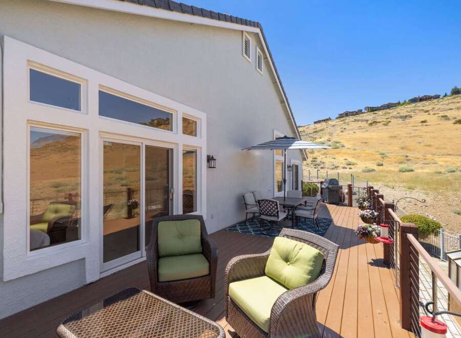 Enjoy breathtaking views from this expansive deck, perfect for entertaining or relaxing.