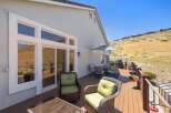 Enjoy breathtaking views from this expansive deck, perfect for entertaining or relaxing.