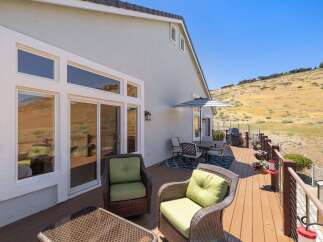 Enjoy breathtaking views from this expansive deck, perfect for entertaining or relaxing.