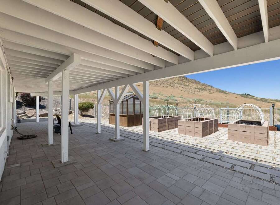 Enjoy outdoor living with this spacious covered patio, perfect for entertaining or relaxing.