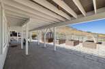 Enjoy outdoor living with this spacious covered patio, perfect for entertaining or relaxing.