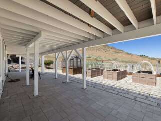 Enjoy outdoor living with this spacious covered patio, perfect for entertaining or relaxing.