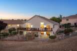Experience luxurious outdoor living with this stunning backyard featuring a spacious multi-level deck perfect for entertaining.