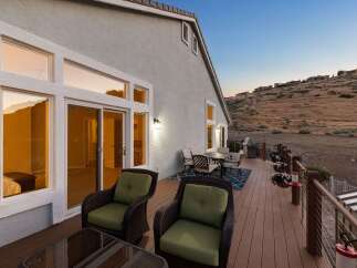 Enjoy breathtaking sunset views from this stunning deck, perfect for outdoor entertaining.