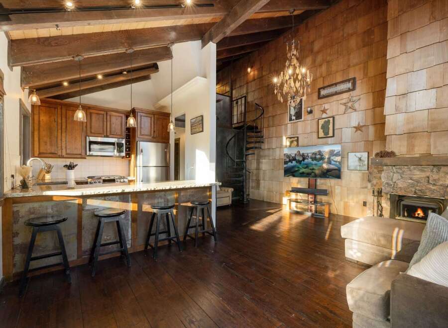 Experience rustic charm and modern comfort in this stunning open-concept living space.
