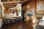 Experience rustic charm and modern comfort in this stunning open-concept living space.