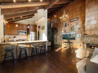 Experience rustic charm and modern comfort in this stunning open-concept living space.