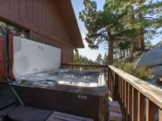 Experience ultimate relaxation with this inviting hot tub, perfectly situated on a private deck with stunning mountain views.