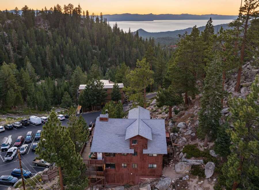 Nestled amidst a dense pine forest with a stunning lake view, this property offers a unique mountain retreat.