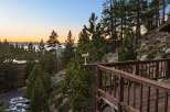 Experience breathtaking lake and mountain views from this stunning property, nestled amongst tall pine trees.