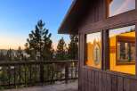 Experience breathtaking sunset views from this charming cabin nestled among pine trees.