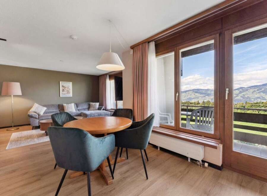 Experience breathtaking mountain views from this charming living and dining area.