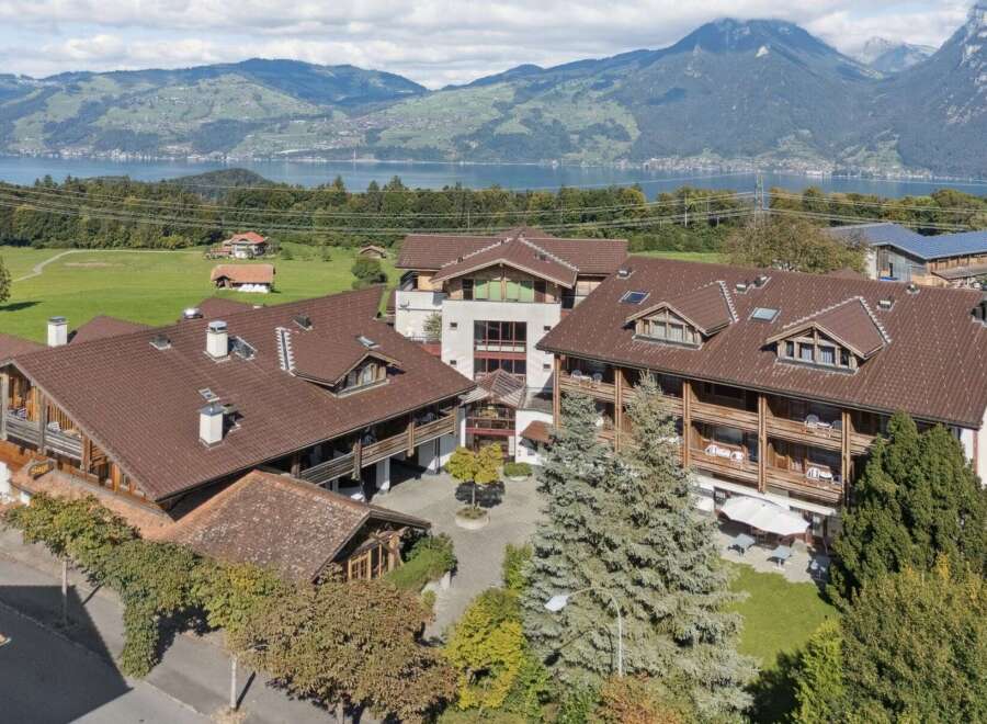 Experience breathtaking mountain and lake views from this stunning property, featuring charming alpine architecture and spacious balconies.