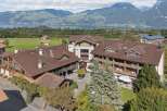 Experience breathtaking mountain and lake views from this stunning property, featuring charming alpine architecture and spacious balconies.