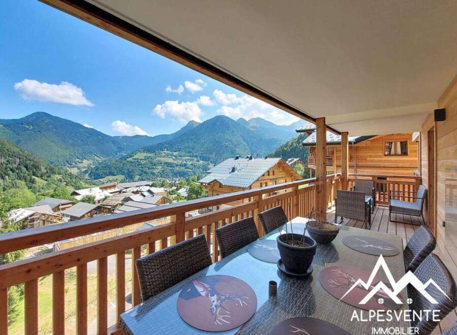 Enjoy breathtaking mountain views from this stunning balcony, perfect for al fresco dining or relaxing with a cup of coffee.