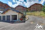 Discover this charming property featuring a spacious garage with multiple bays, perfect for vehicle storage or a workshop.