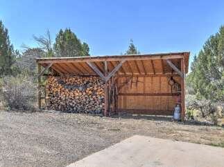 This property features a spacious wood shed, perfect for storing firewood and outdoor equipment.