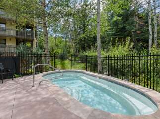 Enjoy a relaxing soak in this private outdoor hot tub, perfect for unwinding after a day of adventure.