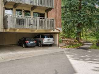 This property offers convenient covered parking with two spaces available, perfect for protecting your vehicles from the elements.