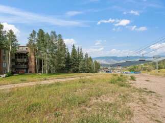 Experience mountain living with this property offering stunning views and convenient access to ski lifts.
