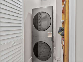 Discover convenient laundry solutions with this stacked Whirlpool washer and dryer unit, perfect for maximizing space in your home.