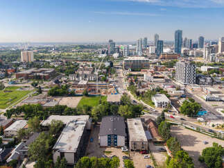 Discover this vibrant urban neighborhood featuring a mix of modern high-rise apartments and charming low-rise buildings, perfect for city living.