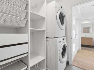 Discover efficient living with this stacked washer and dryer unit, perfect for maximizing space in your laundry area.