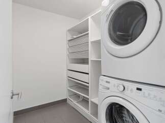 Discover efficient living with this stacked washer and dryer unit, perfect for maximizing space in your laundry area.