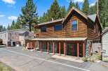 Discover this charming rustic cabin nestled amongst tall pine trees.