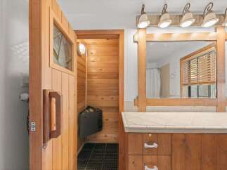 Experience ultimate relaxation in this home featuring a private sauna, perfect for unwinding after a long day.