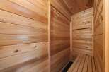Step into tranquility with this exquisite cedar sauna, designed to offer a luxurious and rejuvenating experience.