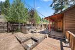 Escape to this charming rustic cabin retreat, featuring a relaxing hot tub perfect for unwinding after a day of adventure.